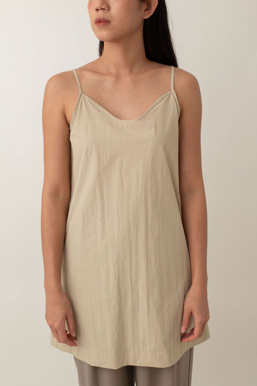 Made from lightweight, breathable fabric, the Jocelyn top is perfect for easy, breezy days. With its delicate spaghetti straps and flattering V-neckline, it adds a touch of femininity to any outfit. The neutral color exudes an earthy vibe that pairs well with just about anything.