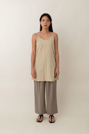 Made from lightweight, breathable fabric, the Jocelyn top is perfect for easy, breezy days. With its delicate spaghetti straps and flattering V-neckline, it adds a touch of femininity to any outfit. The neutral color exudes an earthy vibe that pairs well with just about anything.