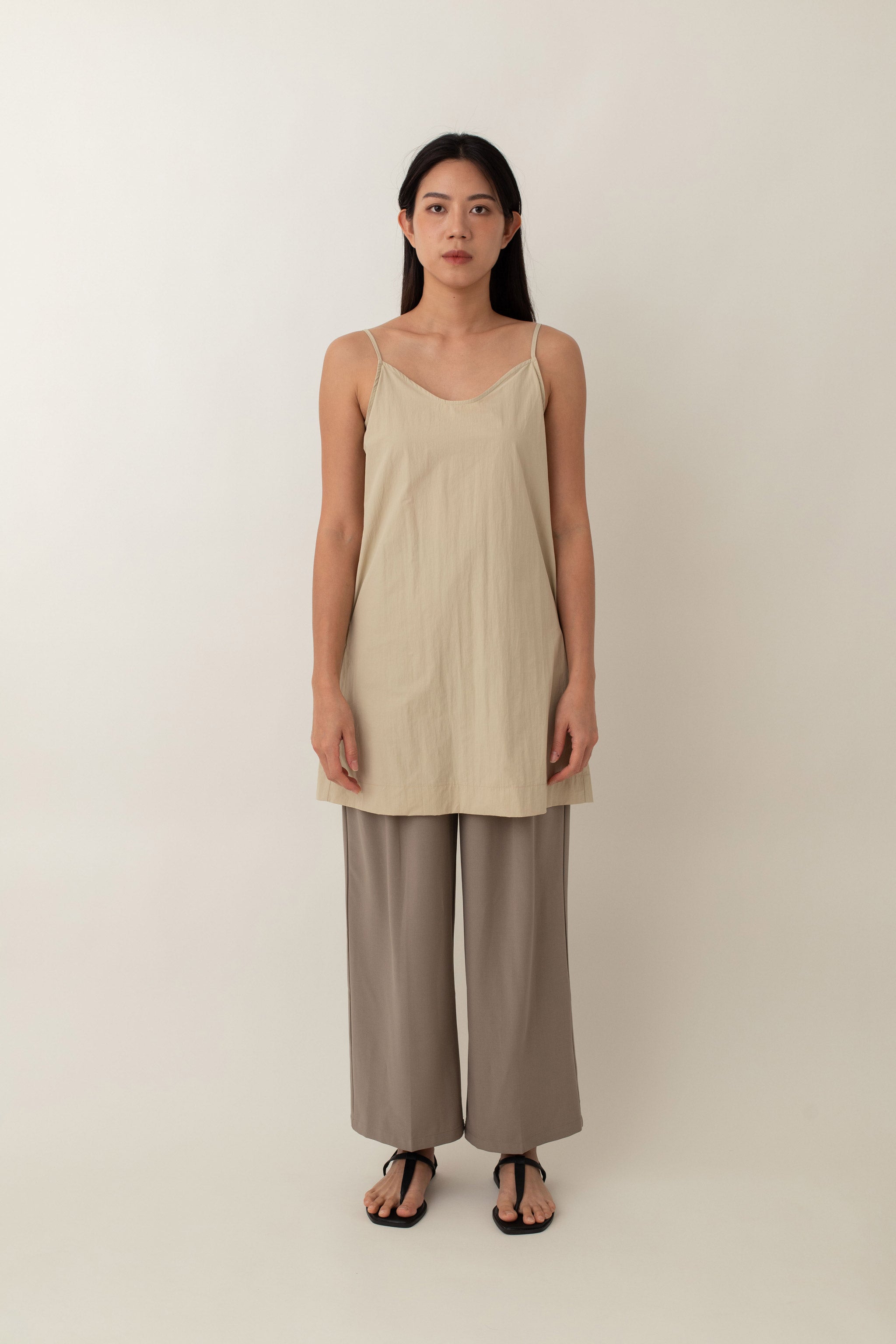 Made from lightweight, breathable fabric, the Jocelyn top is perfect for easy, breezy days. With its delicate spaghetti straps and flattering V-neckline, it adds a touch of femininity to any outfit. The neutral color exudes an earthy vibe that pairs well with just about anything.