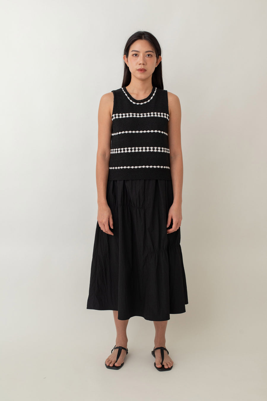 Whether you opt for the classic black or refreshing white, this Mia top effortlessly enhances any outfit with its delicate contrasting stripes. The cozy knit texture and relaxed fit provide all-day comfort, making it ideal for a laid-back yet chic style.