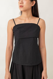 Sleek, modern, and super comfy! The Noelle Camisole Top has a draped front for a stylish twist, and the fitted bust flares out just enough to give you an effortless vibe. Plus, with a back zipper, it's a breeze to slip on and off.