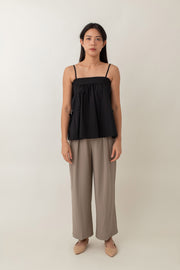 Tara features thin adjustable straps and a loose, comfy fit, perfect for a laid-back vibe. The cute side ties add a playful touch, while the gathered fabric at the bust gives it a soft, feminine look. It's a versatile piece that effortlessly transitions from a casual day out to a date night.