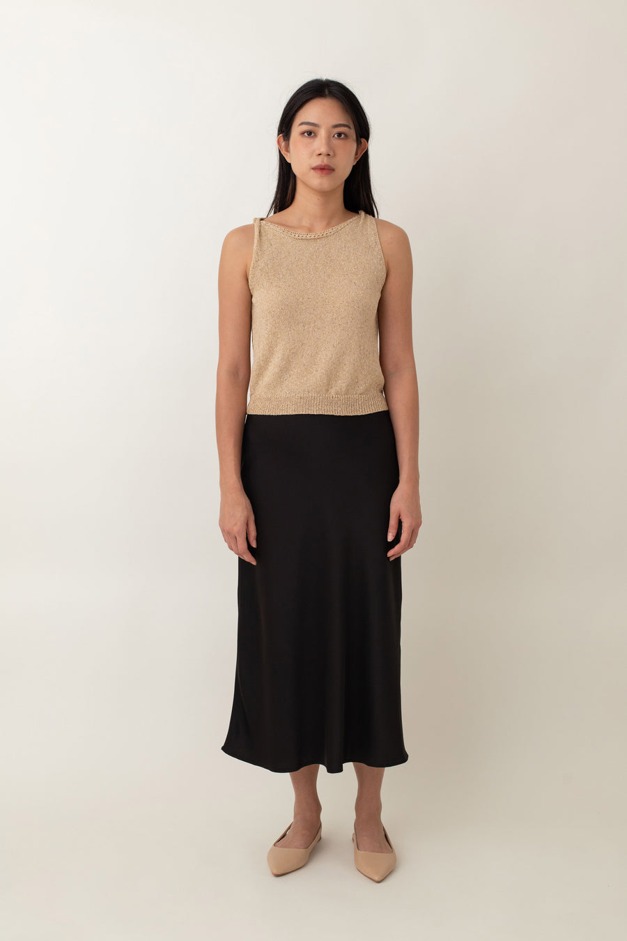 Crafted from silky fabric that feels smooth to the touch and features a subtle, beautiful sheen, the Thalia skirt flares gently from the waist. This design creates a flattering, flowy silhouette that moves gracefully with you.
