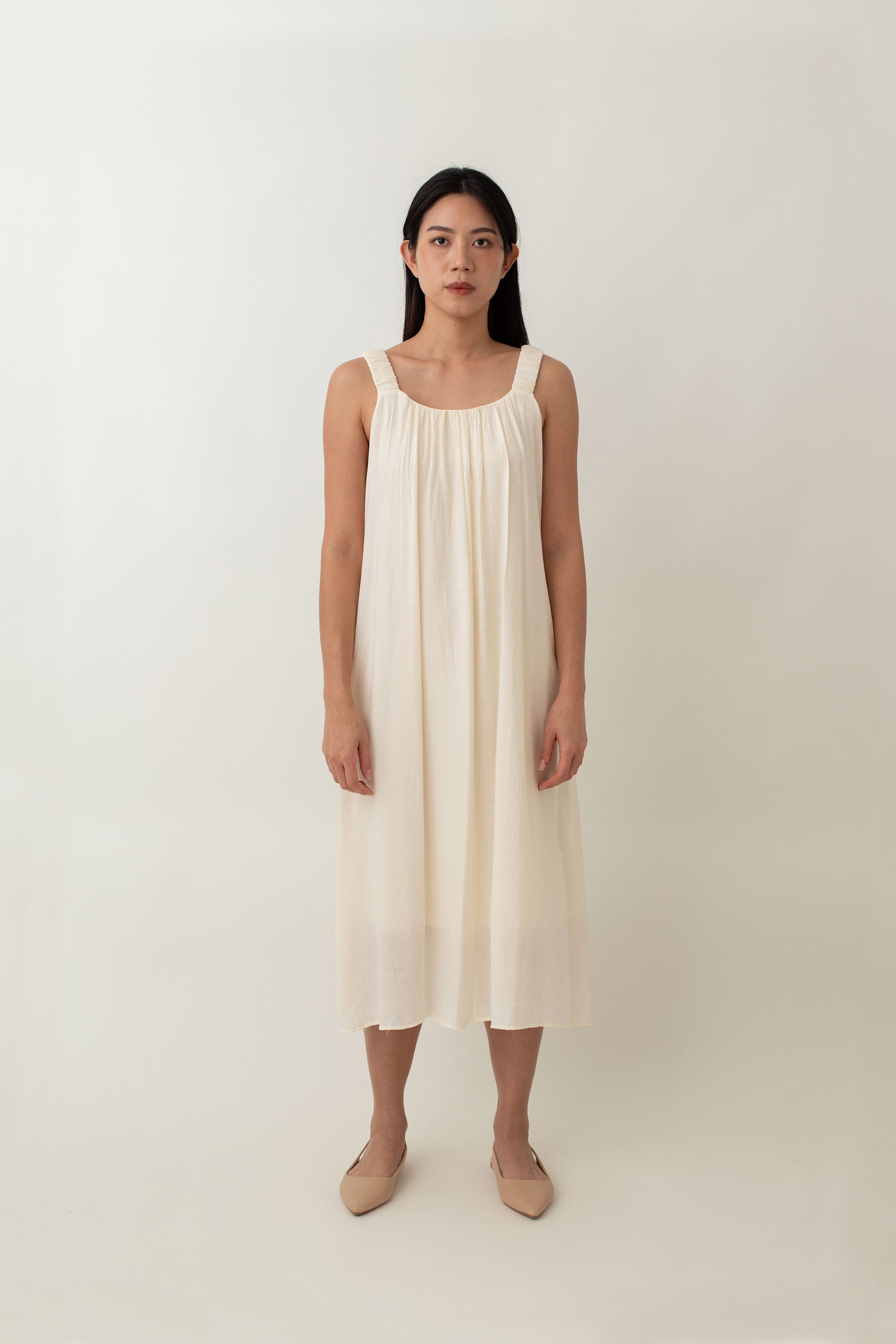 Calliope dress features a soft, flowy fabric that drapes beautifully. The relaxed fit, coupled with delicate pleats at the neckline, creates a graceful silhouette that flatters all body types. It also comes with thoughtful details, such as side pockets, and adjustable tie detail,&nbsp;allowing you to customize the fit and style to your preference.&nbsp;Whether you choose to tie it at the front, back, or side, this versatile detail adds a unique touch to this dress.