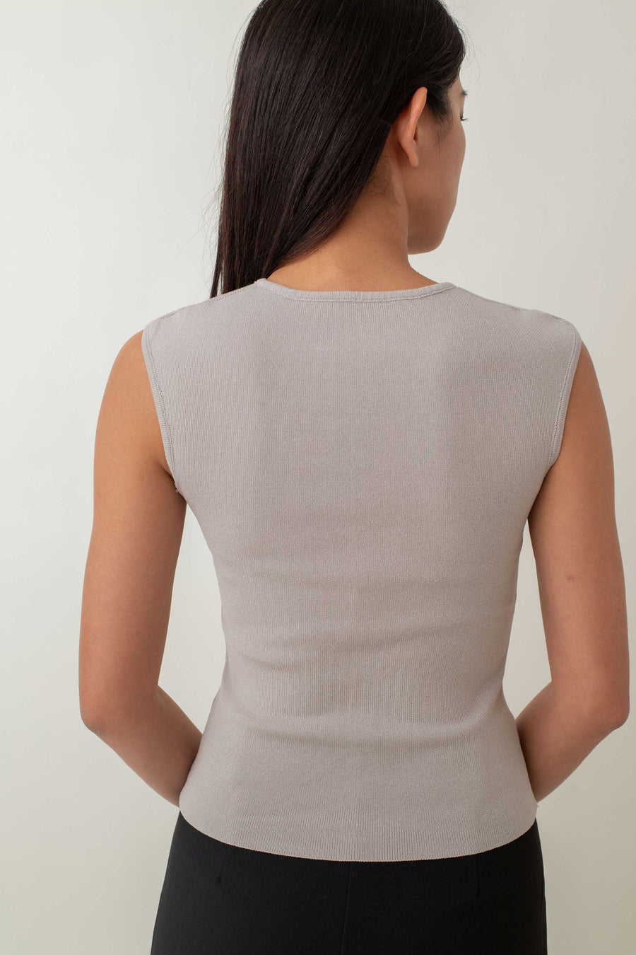 Crafted from a soft, stretchy fabric, Xanthe offers a comfortable fit that flatters your figure. The standout feature is the intricate knot detail at the front, adding a unique twist to a classic design. Pair it with high-waisted skirts or tailored pants for a chic, polished look, or dress it down with jeans for a stylish yet casual outfit.