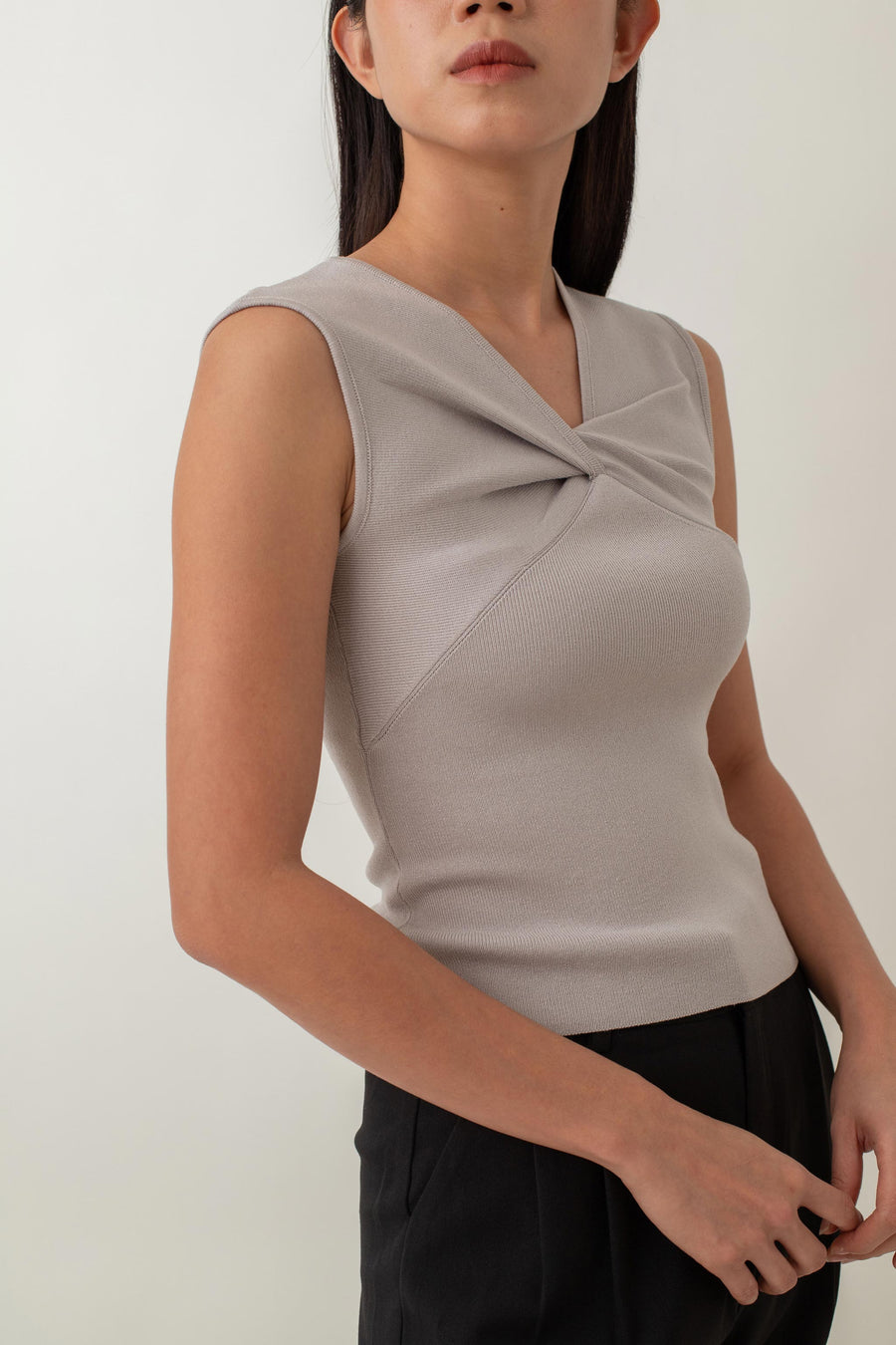 Crafted from a soft, stretchy fabric, Xanthe offers a comfortable fit that flatters your figure. The standout feature is the intricate knot detail at the front, adding a unique twist to a classic design. Pair it with high-waisted skirts or tailored pants for a chic, polished look, or dress it down with jeans for a stylish yet casual outfit.