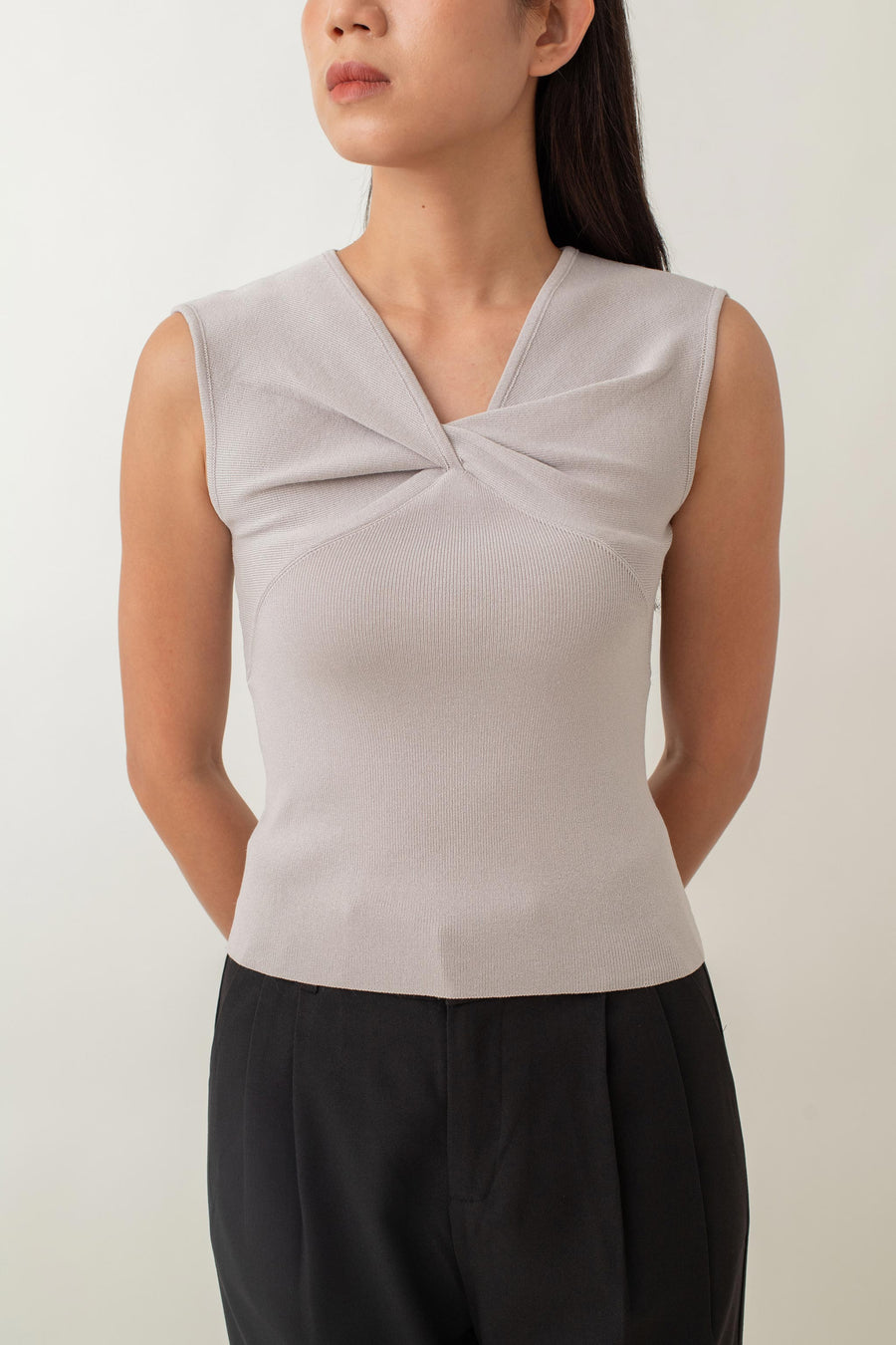 Crafted from a soft, stretchy fabric, Xanthe offers a comfortable fit that flatters your figure. The standout feature is the intricate knot detail at the front, adding a unique twist to a classic design. Pair it with high-waisted skirts or tailored pants for a chic, polished look, or dress it down with jeans for a stylish yet casual outfit.
