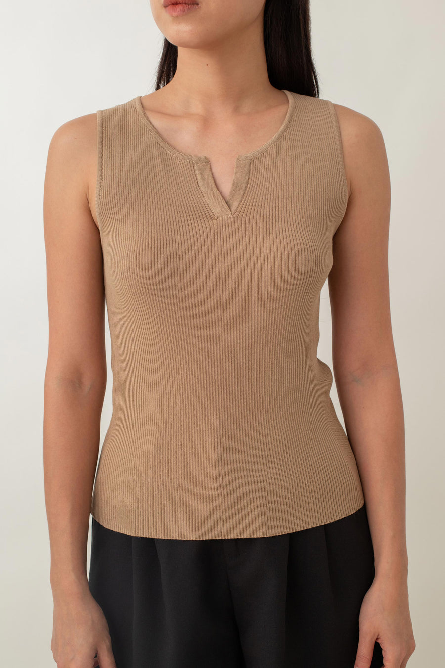 Olivia is your go-to for a chic, everyday look. With its ribbed texture and comfy stretch, this fitted top hugs your curves perfectly. The notched neckline adds a touch of flair, giving it a polished edge. Style it with jeans for a laid-back vibe or pair it with a skirt for a more dressed-up look.