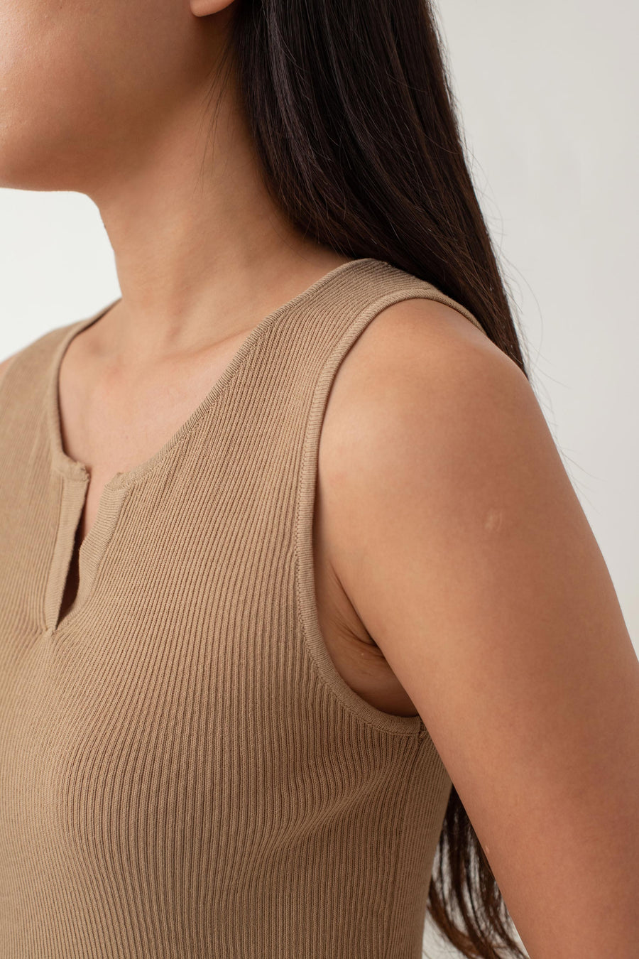 Olivia is your go-to for a chic, everyday look. With its ribbed texture and comfy stretch, this fitted top hugs your curves perfectly. The notched neckline adds a touch of flair, giving it a polished edge. Style it with jeans for a laid-back vibe or pair it with a skirt for a more dressed-up look.