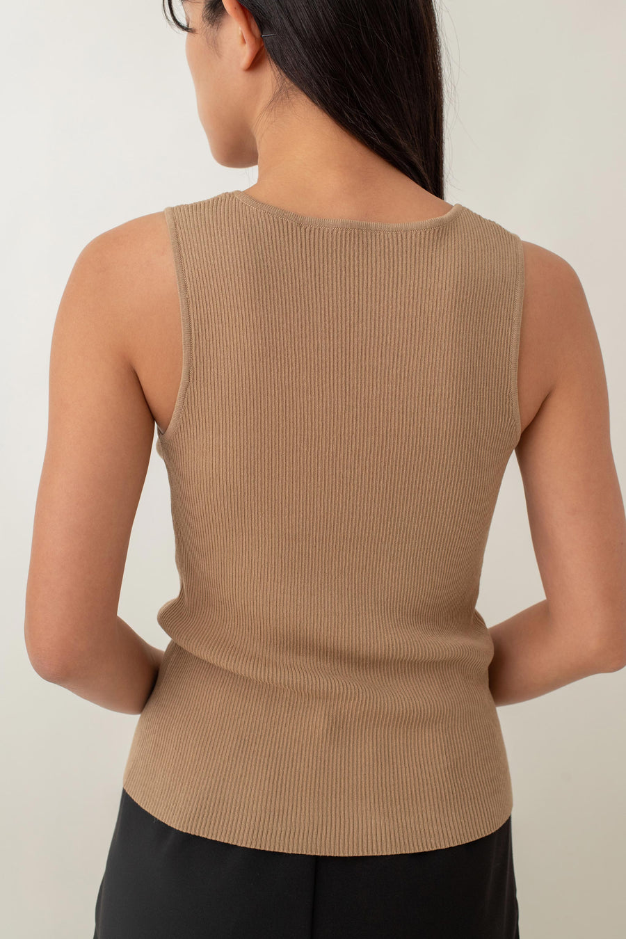 Olivia is your go-to for a chic, everyday look. With its ribbed texture and comfy stretch, this fitted top hugs your curves perfectly. The notched neckline adds a touch of flair, giving it a polished edge. Style it with jeans for a laid-back vibe or pair it with a skirt for a more dressed-up look.
