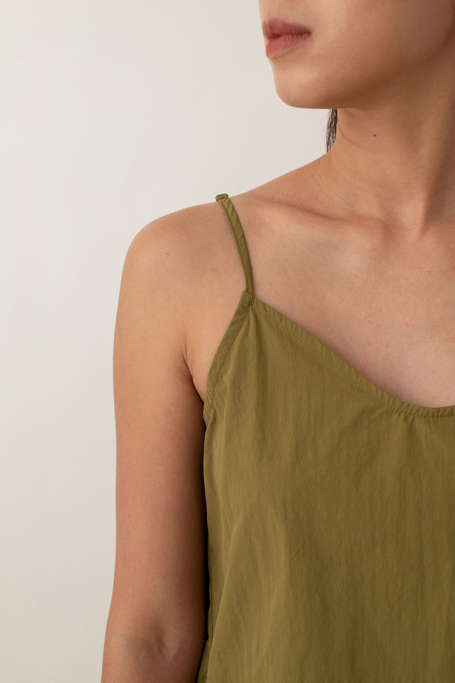 Made from lightweight, breathable fabric, the Jocelyn top is perfect for easy, breezy days. With its delicate spaghetti straps and flattering V-neckline, it adds a touch of femininity to any outfit. The neutral color exudes an earthy vibe that pairs well with just about anything.