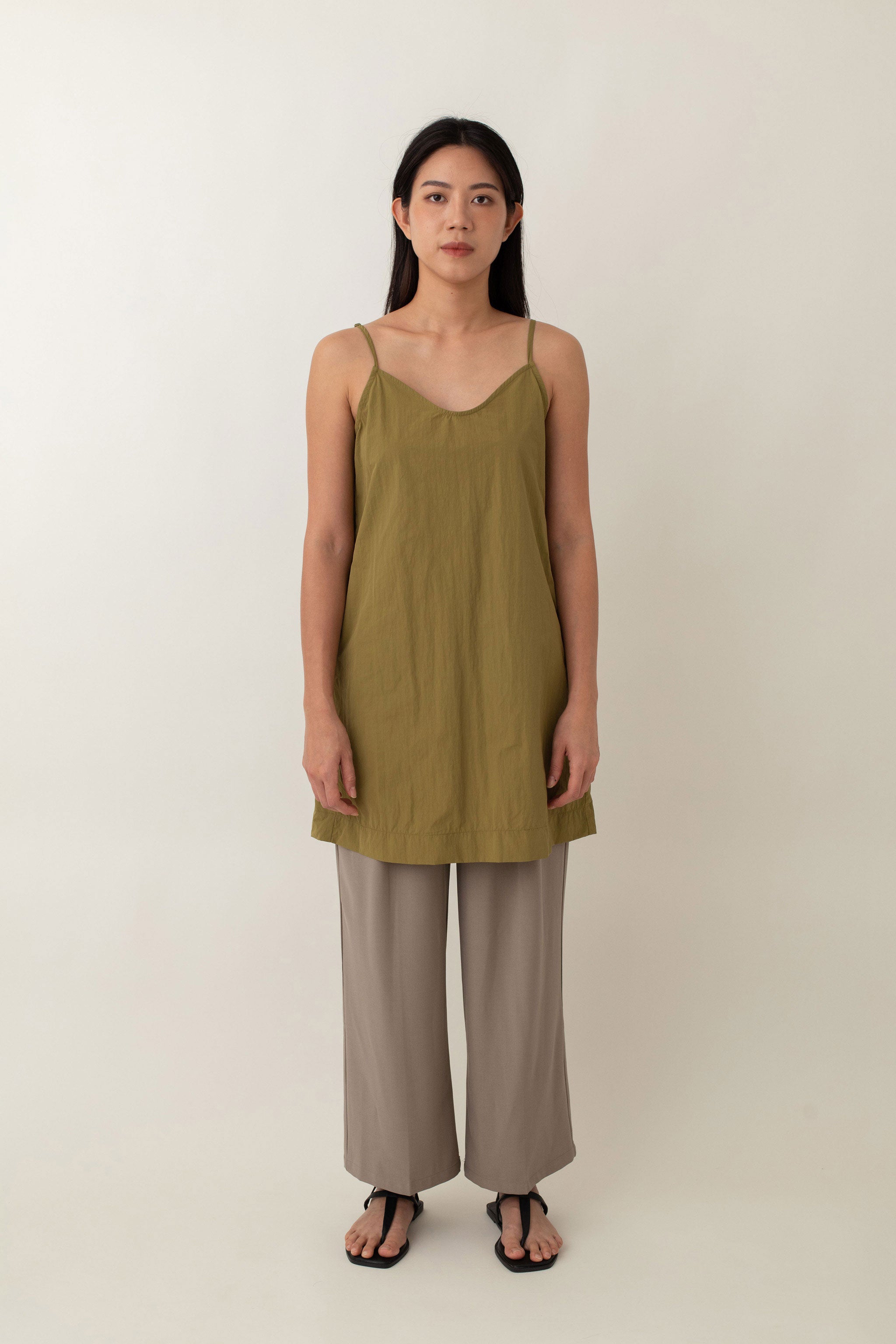 Made from lightweight, breathable fabric, the Jocelyn top is perfect for easy, breezy days. With its delicate spaghetti straps and flattering V-neckline, it adds a touch of femininity to any outfit. The neutral color exudes an earthy vibe that pairs well with just about anything.