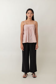 Tara features thin adjustable straps and a loose, comfy fit, perfect for a laid-back vibe. The cute side ties add a playful touch, while the gathered fabric at the bust gives it a soft, feminine look. It's a versatile piece that effortlessly transitions from a casual day out to a date night.