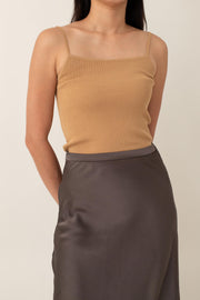 Crafted from silky fabric that feels smooth to the touch and features a subtle, beautiful sheen, the Thalia skirt flares gently from the waist. This design creates a flattering, flowy silhouette that moves gracefully with you.