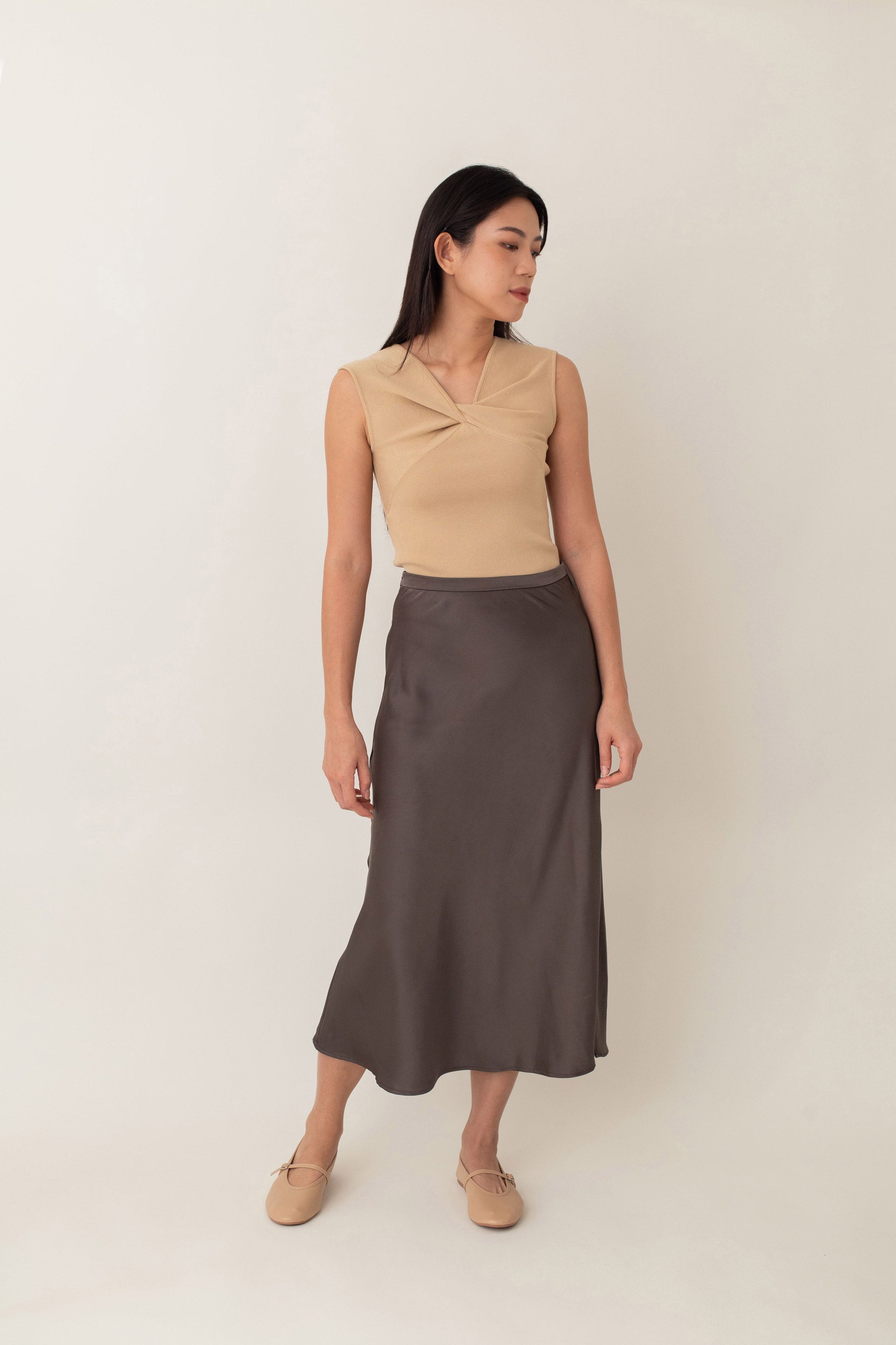 Crafted from silky fabric that feels smooth to the touch and features a subtle, beautiful sheen, the Thalia skirt flares gently from the waist. This design creates a flattering, flowy silhouette that moves gracefully with you.