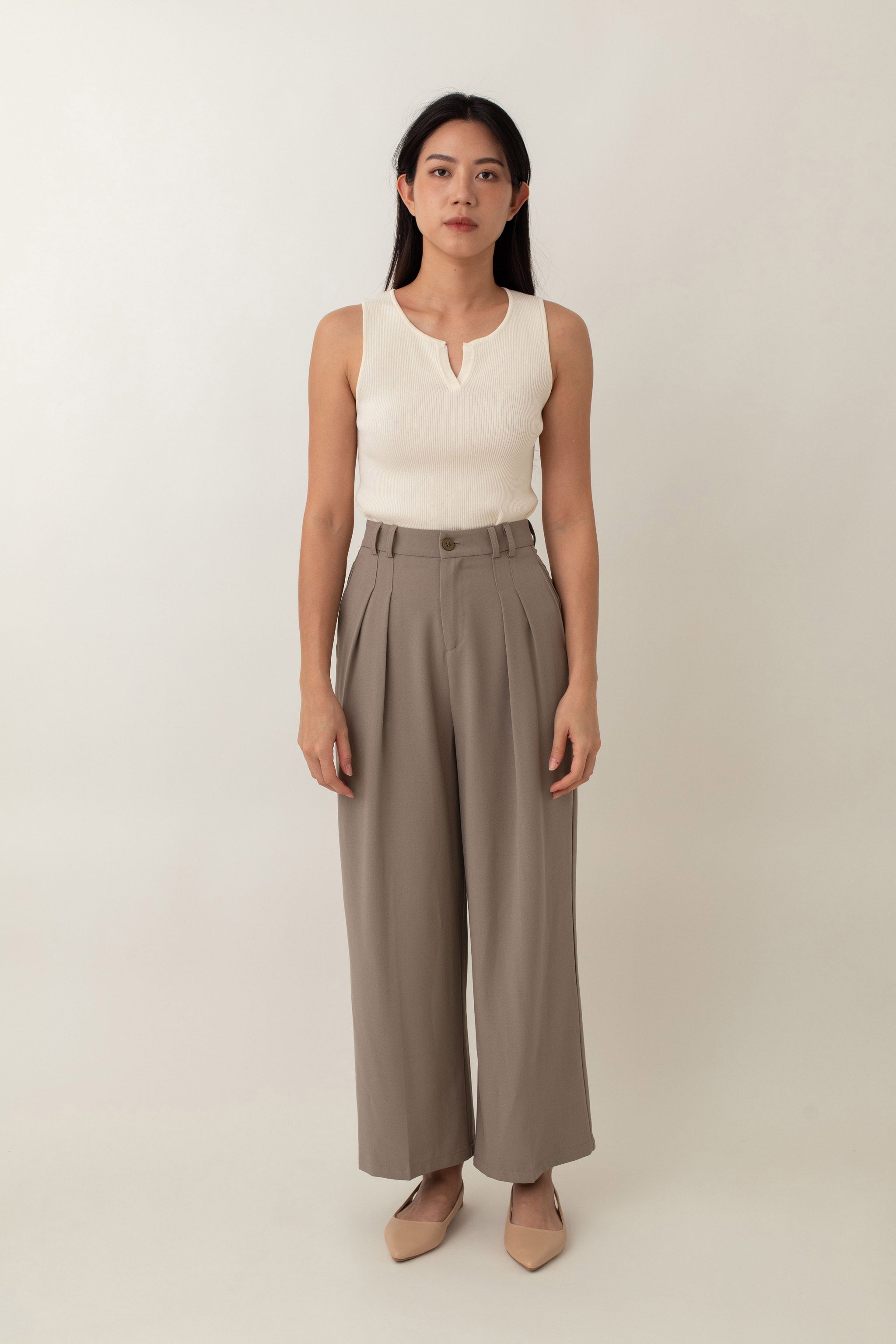 Olivia is your go-to for a chic, everyday look. With its ribbed texture and comfy stretch, this fitted top hugs your curves perfectly. The notched neckline adds a touch of flair, giving it a polished edge. Style it with jeans for a laid-back vibe or pair it with a skirt for a more dressed-up look.