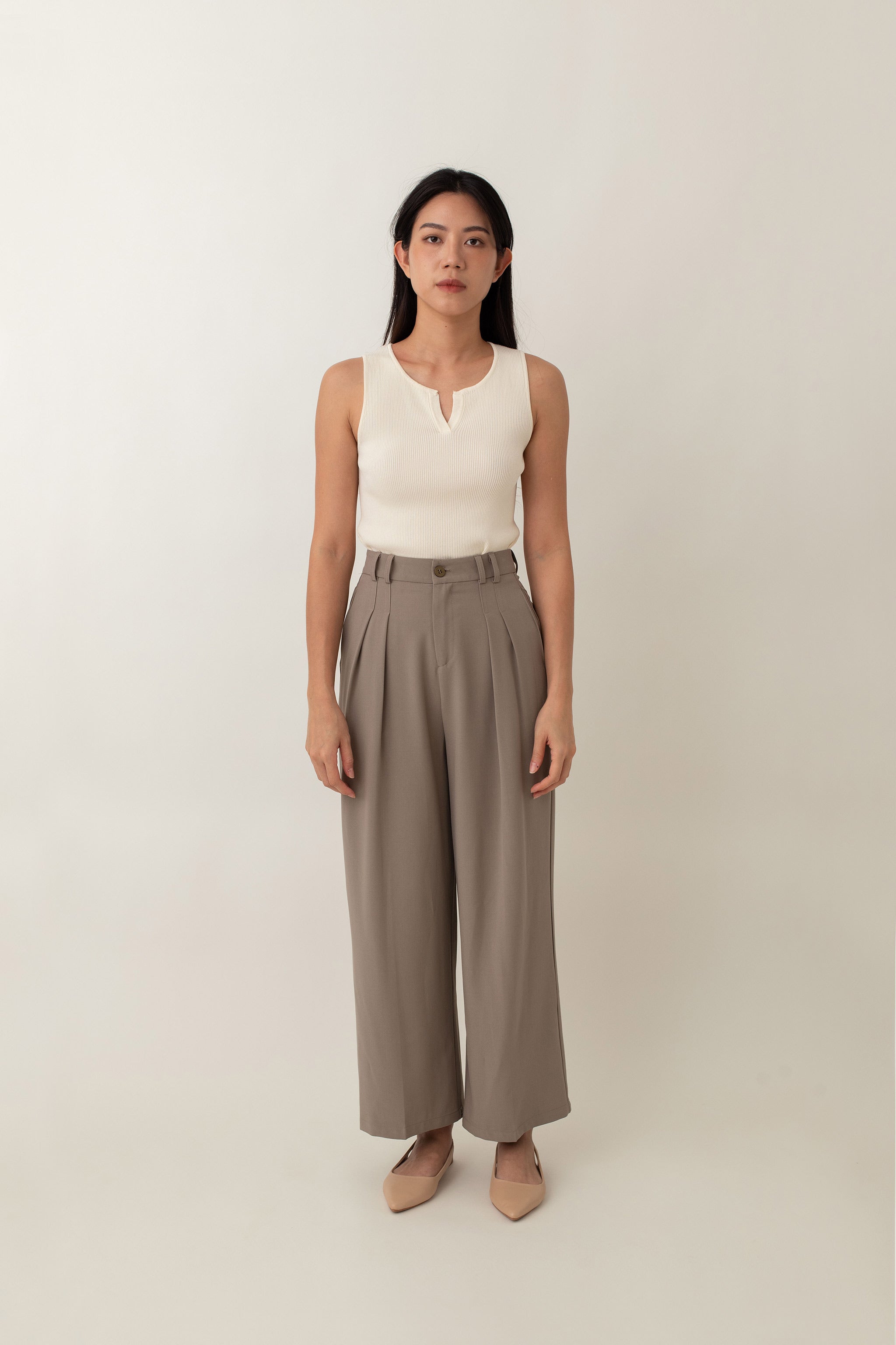 Olivia is your go-to for a chic, everyday look. With its ribbed texture and comfy stretch, this fitted top hugs your curves perfectly. The notched neckline adds a touch of flair, giving it a polished edge. Style it with jeans for a laid-back vibe or pair it with a skirt for a more dressed-up look.